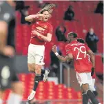  ?? AFP ?? Manchester United’s Edinson Cavani, left, celebrates after scoring against Granada.