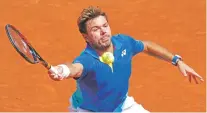  ?? CHRISTOPHE ENA/THE ASSOCIATED PRESS ?? Stan Wawrinka returning a shot Friday against Andy Murray at the French Open in Paris, is in his fourth Grand Slam Final and will face Rafael Nadal.