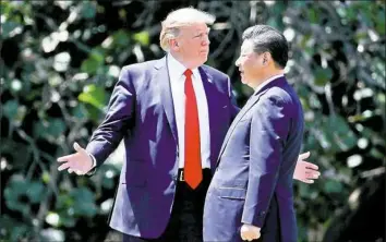  ?? Alex Brandon/Associated Press ?? President Donald Trump with Chinese President Xi Jinping at Mar-a-Lago, April 7.