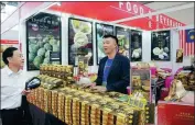  ?? WANG ZHUANGFEI / CHINA DAILY ?? A stand displaying dried-durian products at the 15th ChinaASEAN Expo.