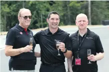  ??  ?? Jim Treliving, of Dragon’s Den fame, race-car driver Max Papis and Peter Trzewik, president of GAIN Dealer Group.