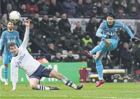  ?? ?? Tottenham Hotspur’s Son Heung-min scores their side’s first goal of the game during the Emirates FA Cup fourth round match at Deepdale Stadium.