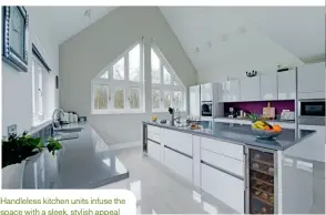  ??  ?? Handleless kitchen units infuse the space with a sleek, stylish appeal