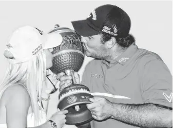  ?? ANDREW WEBER, USA TODAY SPORTS ?? Patrick Reed, with wife Justine, held the lead during the final round and won by one stroke.