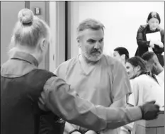  ?? AP PHOTO/MARK THIESSEN ?? Brian Steven Smith (second from left) is escorted out of a courtroom in Anchorage, Alaska, on Monday.