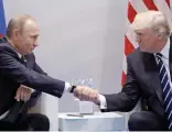  ??  ?? Shake: Putin with Trump at summit