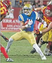  ?? Luis Sinco Los Angeles Times ?? SOSO JAMABO, who ran for 446 yards last season, looks for running room in UCLA’s loss to USC.