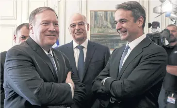  ?? BLOOMBERG ?? Mike Pompeo, left, poses with Greek Prime Minister Kyriakos Mitsotakis, right, in Athens, Greece on Saturday.