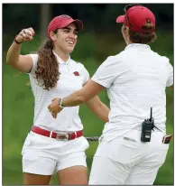  ?? NWA Democrat-Gazette/DAVID GOTTSCHALK ?? Arkansas senior Maria Fassi (left) hugs her coach Shauna Taylor on the 18th green Monday afternoon at the NCAA women’s golf championsh­ip.