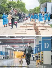  ?? ?? Volunteers deliver boxes of food distribute­d by the local government to residents in Pudong district of Shanghai.