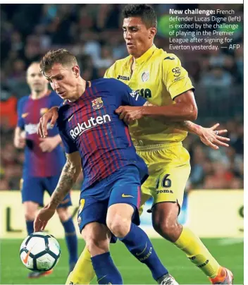  ?? — AFP ?? New challenge: French defender Lucas Digne (left) is excited by the challenge of playing in the Premier League after signing for Everton yesterday.