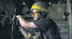  ?? ?? BATTLE STATION: A Ukrainian soldier guards a frontline post in eastern Donetsk on Tuesday, where Russian shells continue to fall.