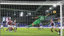  ??  ?? SAVIOUR: Emiliano Martinez tips Dan Burn’s header round the post