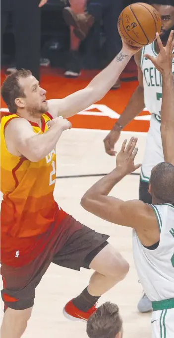  ?? Picture: AP/RICK BOWMER ?? Utah Jazz forward Joe Ingles goes to the basket as Boston Celtics centre Al Horford defends in the first half of their NBA clash