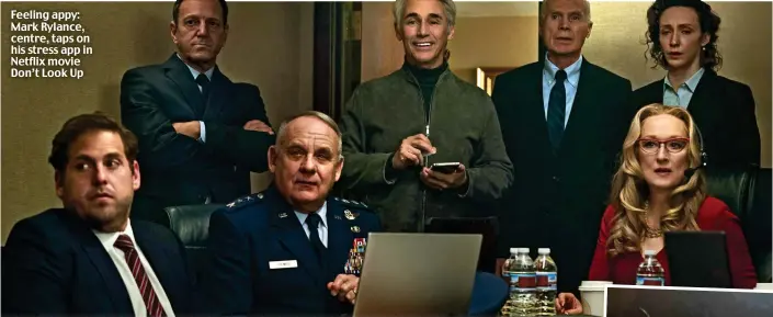  ?? ?? Feeling appy: Mark Rylance, centre, taps on his stress app in Netflix movie Don’t Look Up