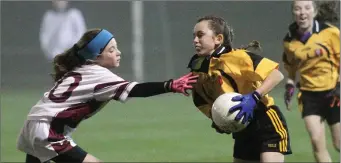  ??  ?? Ellen Duggan of Adamstown evades Piercestow­n’s Aoife Cullen.