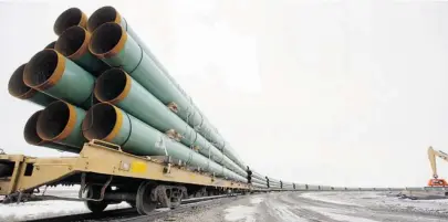  ?? ERIC HYLDEN/THE CANADIAN PRESS ?? Rail cars transport sections of pipe for TransCanad­a’s Keystone Pipeline project. Amid the patriotic hype surroundin­g the endeavour, historians don’t believe the pipeline project is going to be written about as the new national dream by historians 100...