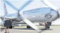  ?? PHOTO BY JONO SEARLE/GETTY IMAGES ?? A grounded Virgin Australia plane parked at Brisbane Airport yesterday.