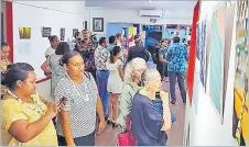  ?? Picture: FIJI SPORTS COUNCIL ?? Guests at the Alliance Francaise in Suva during the “Champions” exhibition.
Guests at the photo exhibition at the Alliance Francaise in Suva.