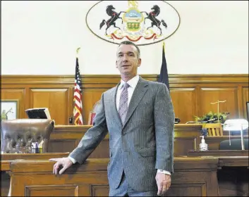  ?? SEAN STIPP/PITTSBURGH TRIBUNE-REVIEW VIA AP ?? Casey Mullen stands in a courtroom at the City County Building in Pittsburgh. Mullen was convicted of drug dealing two decades ago. He went to prison, got clean and became an attorney.