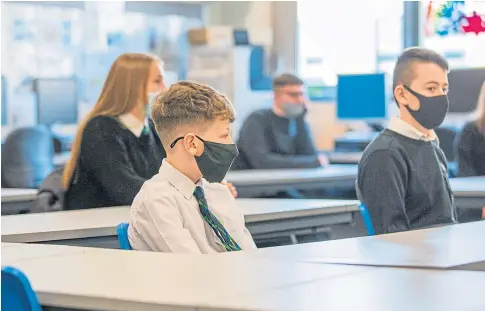  ??  ?? SAFE LEARNING: First year pupils return to St Paul’s RC Academy in Dundee after easing of coronaviru­s restrictio­ns.