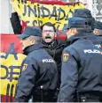  ??  ?? Pro-unity protesters hold Spanish flags as Forcadell arrives at Spain’s Supreme Court