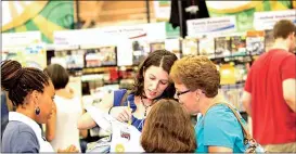  ??  ?? Parents examine curriculum at the annual CSTHEA Curriculum Fair & Home Education Expo, which takes place this year on July 21 and 22 at Camp Jordan in East Ridge, Tenn. (Photo courtesy of CSTHEA)