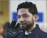  ?? PAUL BEATY - ASSOCIATED PRESS ?? Actor Jussie Smollett smiles and waves to supporters March 26before leaving Cook County Court after his charges were dropped in Chicago.