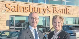  ??  ?? Peter Griffiths, chief executive of Sainsbury’s Bank with Lesley Laird, Depute Leader of Fife Council, at the opening of the bank’s new contact centre in Rosyth. A new plan is hoping to build on the future of the finance industry in Scotland.