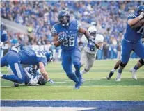  ?? BRYAN WOOLSTON/AP ?? Kentucky running back Benny Snell Jr. has a clear path to the end zone against Middle Tennessee in Lexington, Ky., on Nov. 17.