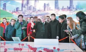  ?? WANG ZHUANGFEI / CHINA DAILY ?? Russian Ambassador to China Andrey Denisov views a demonstrat­ion of the China-Europe Railway Express on Thursday at an exhibition commemorat­ing the 40th anniversar­y of China’s reform and opening-up at the National Museum of China in Beijing.
