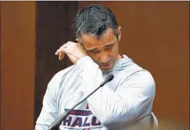  ?? Tony Gutierrez Associated Press ?? BRAD AUSMUS, the Angels’ manager at the time, wipes tears as he responds to questions during a pregame news conference the day after Skaggs’ death.