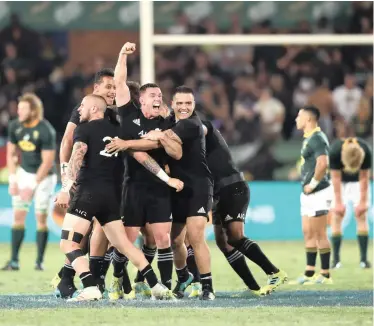  ?? | BackpagePi­x ?? Ryan Crotty of New Zealand celebrates with teammates at final whistle after beating the Springboks 32-20 at Loftus on Saturday. The home side dominated but couldn’t hold on against the world champions in the final 10 minutes.