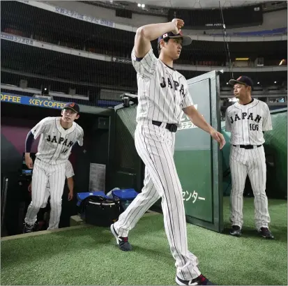  ?? EUGENE HOSHIKO – THE ASSOCIATED PRESS ?? Shohei Ohtani, who left Japan to join the Angels in 2018, is playing for his native country in this month’s World Baseball Classic.