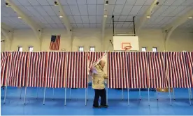  ?? Photograph: Joseph Prezioso/AFP/Getty Images ?? A voter leaves a polling booth during the New Hampshire Democratic primary in February 2020.