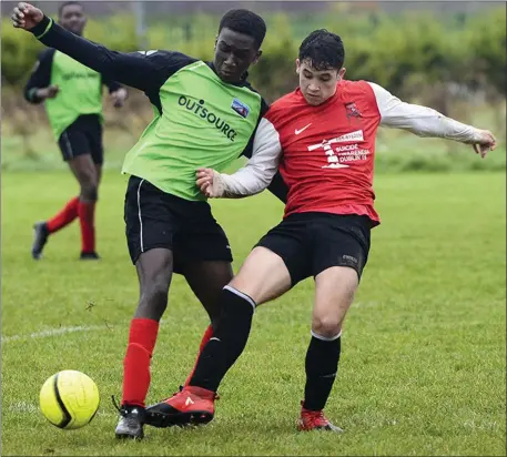  ??  ?? Drogheda Town do battle with Corduff during Sunday morning’s NDSL Under-16 game at St Oliver’s CC.