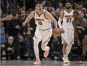  ?? AARON ONTIVEROZ — THE DENVER POST ?? The Nuggets’ Nikola Jokic, left, runs in transition against the Kings at Ball Arena in Denver on Wednesday.