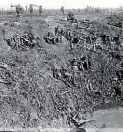  ?? ALEXANDER TURNBULL LIBRARY ?? New Zealand Engineers resting in a large shell hole.