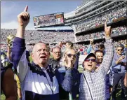  ?? ARBOGAST / AP CHARLES REX ?? Notre Dame coach Brian Kelly (left) daughter Grace (center) and wife Paqui celebrate Notre Dame’s 41-13 win over Wisconsin on Sept. 25, in Chicago.