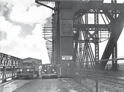  ??  ?? The Frisco and Harahan Bridges circa 1935. The Frisco was built by the Kansas City, Fort Scott & Memphis Railroad and got is name when the Frisco Railroad bought that line, and the bridge, in 1903. It was primarily a railroad bridge, although wagons...