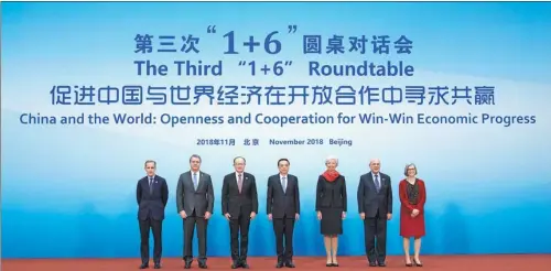  ?? KUANG LINHUA / CHINA DAILY ?? Premier Li Keqiang and leaders of major internatio­nal organizati­ons pose for a group photo at the Third “1+6” Roundtable, a dialogue hosted by Li on Tuesday in Beijing.