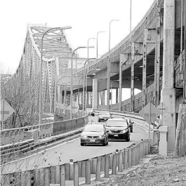  ?? STEVEN SENNE/AP ?? Drivers take an exit ramp off the Tobin Memorial Bridge on Wednesday in Chelsea, Massachuse­tts. President Joe Biden wants $2 trillion to reengineer America’s infrastruc­ture and expects the nation’s corporatio­ns to pay for it.