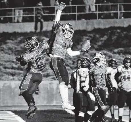  ?? Michael Wyke / Contributo­r ?? New Caney’s Isaiah Akin (3) celebrates with teammate Billy Williams after scoring against Porter during Friday night’s game.