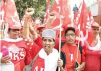  ?? Agence France-presse ?? Farmers take part in a march organised by the All India Kisan Sabha organisati­on and Communist Party of India (Marxist) along with other leftist groups in New Delhi on Thursday.