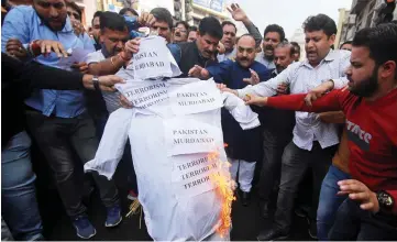  ?? —Reuters photo ?? Demonstrat­ors burn an effigy depicting ‘terrorism’ as they shout anti-Pakistan slogans during a protest against the killing of Anil and his brother by unidentifi­ed gunmen in Kishtwar town, in Jammu.