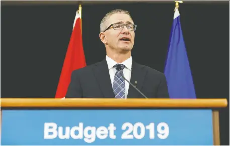  ?? IAN KUCERaK/POSTMEDIA NEWS ?? Alberta Finance Minister Travis Toews justifies cuts to reach a balanced budget in 2022-23 on Thursday in Edmonton by saying his province has had “a spending problem.” If no new pipelines are built, the province expects its revenues will drop by $3 billion.