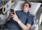  ?? The Canadian Press ?? Former Humboldt Broncos player Ryan Straschnit­zki takes a break after rehab at Foothills Hospital in Calgary.