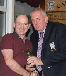  ??  ?? Castleisla­nd Club Captain Denis O’Sullivan presents his Captain’s Prize to competitio­n winner Owen Nolan