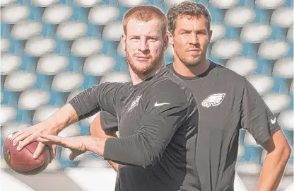  ??  ?? Unlike the Bears, the Eagles had a powder- keg situation with Carson Wentz ( left) and Sam Bradford last year. | MITCHELL LEFF/ GETTY IMAGES