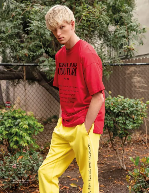  ??  ?? T-shirt by Versace Couture; pants by Helmut Lang